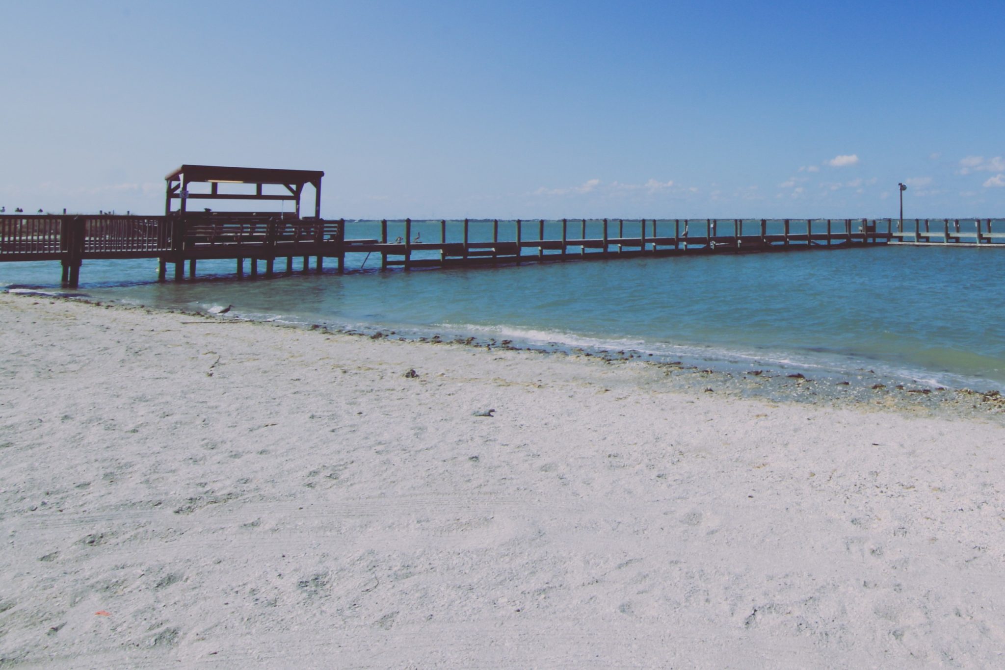 Walking along a beach pier is one of the many things to do in Mustang Island.
