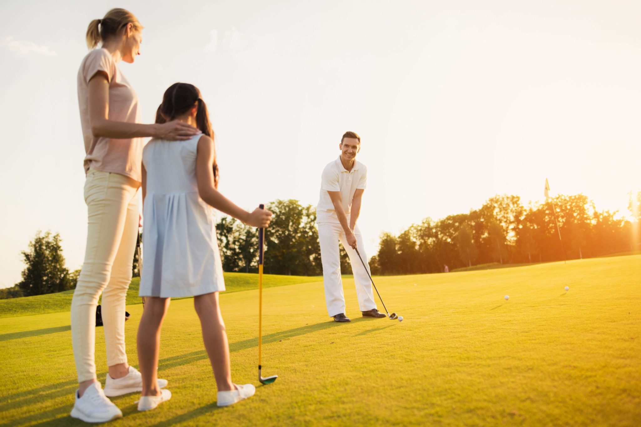 A family of three playing Port Aransas Golf.